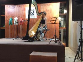 Ruth Bennett harpist from the Yucatan Symphony in concert at Casa de los Venados – Best Places In The World To Retire – International Living